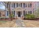 Elegant home featuring a classic facade, manicured shrubs, and stone pathway at 301 Hillsborough St, Chapel Hill, NC 27514