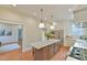 Open kitchen featuring a center island with a marble countertop and decorative hardware at 301 Hillsborough St, Chapel Hill, NC 27514