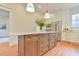 Spacious kitchen featuring a center island with a marble countertop and stainless steel appliances at 301 Hillsborough St, Chapel Hill, NC 27514