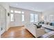 Inviting living room with front door, hardwood floors and stylish furnishings at 301 Hillsborough St, Chapel Hill, NC 27514