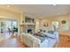 Open concept living room boasts a stone fireplace and connection to dining area at 301 Hillsborough St, Chapel Hill, NC 27514