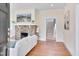 Bright living room featuring a stone fireplace and hardwood floors at 301 Hillsborough St, Chapel Hill, NC 27514