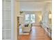 Bright living room featuring hardwood floors, fireplace, large windows and natural light at 301 Hillsborough St, Chapel Hill, NC 27514