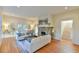 Bright living room features a stone fireplace, hardwood floors, and french doors at 301 Hillsborough St, Chapel Hill, NC 27514