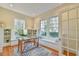 Bright office with large windows, built-in shelving, and a cozy window seat at 301 Hillsborough St, Chapel Hill, NC 27514