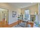 Stylish office features built-in shelving, hardwood floors, and neutral decor at 301 Hillsborough St, Chapel Hill, NC 27514