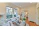 Sunlit office with a built-in window seat, hardwood floors and recessed lighting at 301 Hillsborough St, Chapel Hill, NC 27514