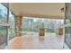 Covered porch with stone pillars and wood floors offer a relaxing outdoor space at 301 Hillsborough St, Chapel Hill, NC 27514
