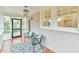 Inviting porch features hardwood floors, a patterned rug, and comfortable seating at 301 Hillsborough St, Chapel Hill, NC 27514