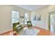 Bright sitting area with hardwood floors, natural light and comfortable chairs at 301 Hillsborough St, Chapel Hill, NC 27514