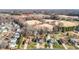 Charming neighborhood view of homes near well-maintained baseball fields and surrounded by a lush wooded landscape at 304 Briarwood Dr, Mebane, NC 27302