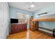 Well-lit bedroom with hardwood floors, a bunk bed, a TV, and plenty of storage with the large dresser at 304 Briarwood Dr, Mebane, NC 27302