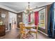Bright breakfast nook with a chandelier and views of the backyard at 304 Briarwood Dr, Mebane, NC 27302