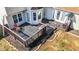 Aerial view of a deck, seating, and manicured landscaping, perfect for relaxation or entertainment at 304 Briarwood Dr, Mebane, NC 27302