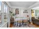 Charming dining room offers space for six and a view into the sunlit living room at 304 Briarwood Dr, Mebane, NC 27302