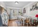 Bright dining room features a table with seating for six and a window overlooking the backyard at 304 Briarwood Dr, Mebane, NC 27302