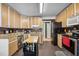 Well-equipped kitchen features an island, modern appliances and dark countertops at 304 Briarwood Dr, Mebane, NC 27302
