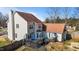 Aerial view of the home's backyard, showcasing a deck, patio, and fenced-in yard at 304 Briarwood Dr, Mebane, NC 27302