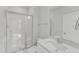 Bathroom featuring a tiled shower with glass doors, neutral floors, vanity, and modern fixtures at 3200 Balcon Ct # 28, Angier, NC 27501