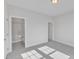 Neutral-toned main bedroom featuring carpeted floors, a connected bathroom and clean white walls at 3200 Balcon Ct # 28, Angier, NC 27501