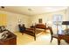 Bright bedroom featuring an empty four-poster bed, built-in closets and neutral colored walls at 350 W Lake Trl, Mebane, NC 27302