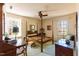 Bright bedroom with a four poster bed, two windows, ceiling fan, and ample space at 350 W Lake Trl, Mebane, NC 27302