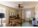 Bedroom featuring a four-poster bed, two windows, ceiling fan and desk area at 350 W Lake Trl, Mebane, NC 27302