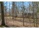 Two-story brick home nestled among mature trees in a serene setting at 350 W Lake Trl, Mebane, NC 27302