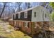 Charming brick two-story home with black shutters and an inviting front entrance at 350 W Lake Trl, Mebane, NC 27302