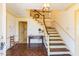 Spacious foyer with hardwood floors, a staircase, and decorative trim at 350 W Lake Trl, Mebane, NC 27302