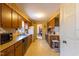 Galley kitchen showcasing wooden cabinetry and bright countertops at 350 W Lake Trl, Mebane, NC 27302