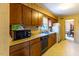 Galley kitchen showcasing wooden cabinetry and bright countertops at 350 W Lake Trl, Mebane, NC 27302