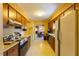 Functional kitchen featuring classic appliances, ample storage, and view into dining room at 350 W Lake Trl, Mebane, NC 27302