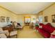 Bright living room featuring vintage decor, large windows, and traditional furnishings at 350 W Lake Trl, Mebane, NC 27302