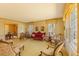 Inviting living room with large windows, traditional furnishings, and vintage decor at 350 W Lake Trl, Mebane, NC 27302