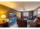 Spacious living room with a fireplace, wood paneling, and comfortable seating at 350 W Lake Trl, Mebane, NC 27302
