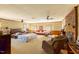 Expansive living room with a brick fireplace, neutral carpet, and a comfortable sitting area at 350 W Lake Trl, Mebane, NC 27302