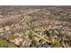 Expansive aerial view of a neighborhood with well-maintained homes, mature trees, and community amenities at 3905 Grandbridge Dr, Apex, NC 27539