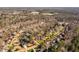 Expansive aerial view of a neighborhood with manicured lawns, mature trees, and swimming pools at 3905 Grandbridge Dr, Apex, NC 27539