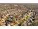 Expansive aerial view of a neighborhood with manicured lawns, mature trees, and community sidewalks at 3905 Grandbridge Dr, Apex, NC 27539