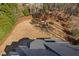 Aerial view of the backyard showcasing the outdoor dining area, hot tub, and patio at 3905 Grandbridge Dr, Apex, NC 27539
