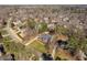 Expansive aerial view of a neighborhood with manicured lawns, mature trees, and well maintained landscaping at 3905 Grandbridge Dr, Apex, NC 27539