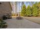 Open-air back patio with a dining set, grill, and spacious layout for outdoor living and entertaining at 3905 Grandbridge Dr, Apex, NC 27539