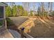 View of spacious backyard from wooden deck, showcasing potential for outdoor activities and landscaping at 3905 Grandbridge Dr, Apex, NC 27539