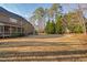 Backyard showing the scale of the property with mature trees and green spaces at 3905 Grandbridge Dr, Apex, NC 27539