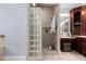 Elegant bathroom featuring a tiled walk-in shower with glass block surround at 3905 Grandbridge Dr, Apex, NC 27539