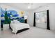 The bedroom features an artistic wall design, window, and ceiling fan at 3905 Grandbridge Dr, Apex, NC 27539