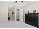 Cozy bedroom with ceiling fan and view into the en suite bathroom at 3905 Grandbridge Dr, Apex, NC 27539