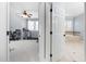 Bright bedroom leading to a luxurious bathroom with a large soaking tub at 3905 Grandbridge Dr, Apex, NC 27539