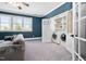 Bonus room complete with a laundry closet, open shelving, and a door that leads to more of the house at 3905 Grandbridge Dr, Apex, NC 27539